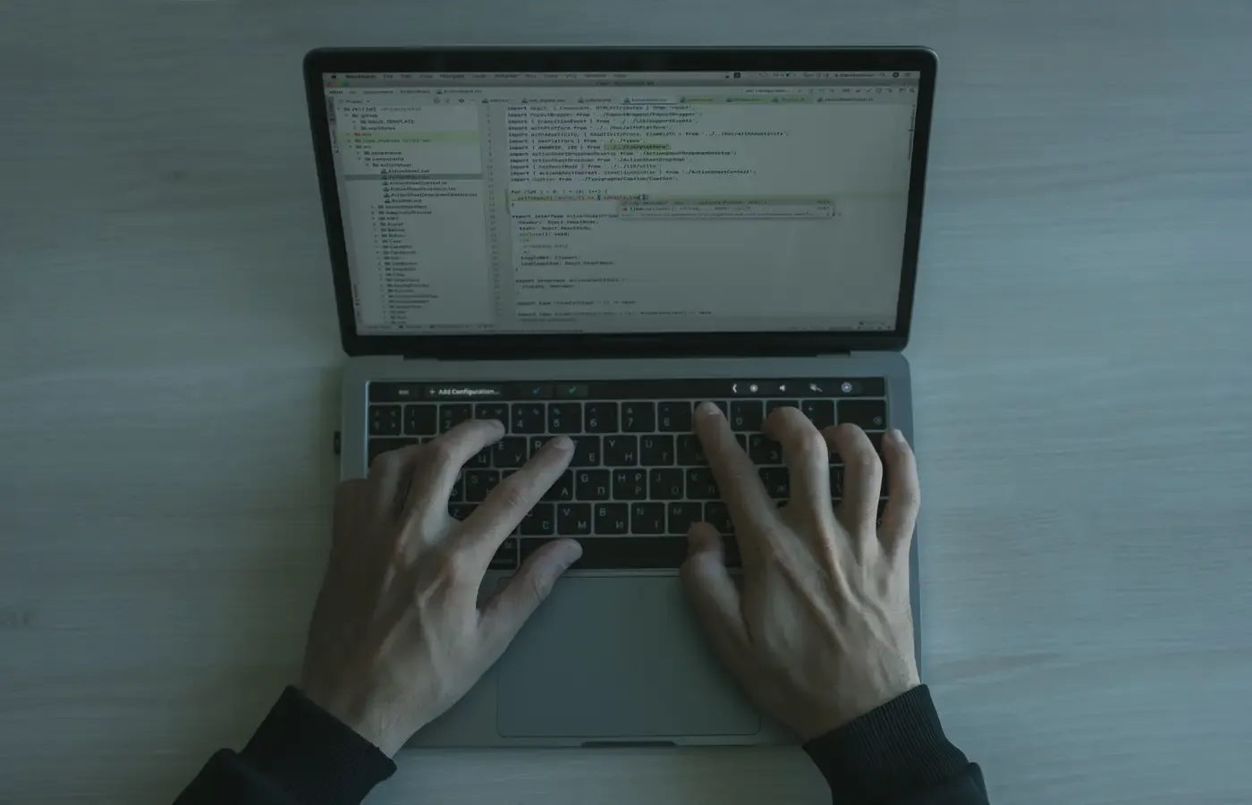 Workflow and integration code open on a laptop during a software build