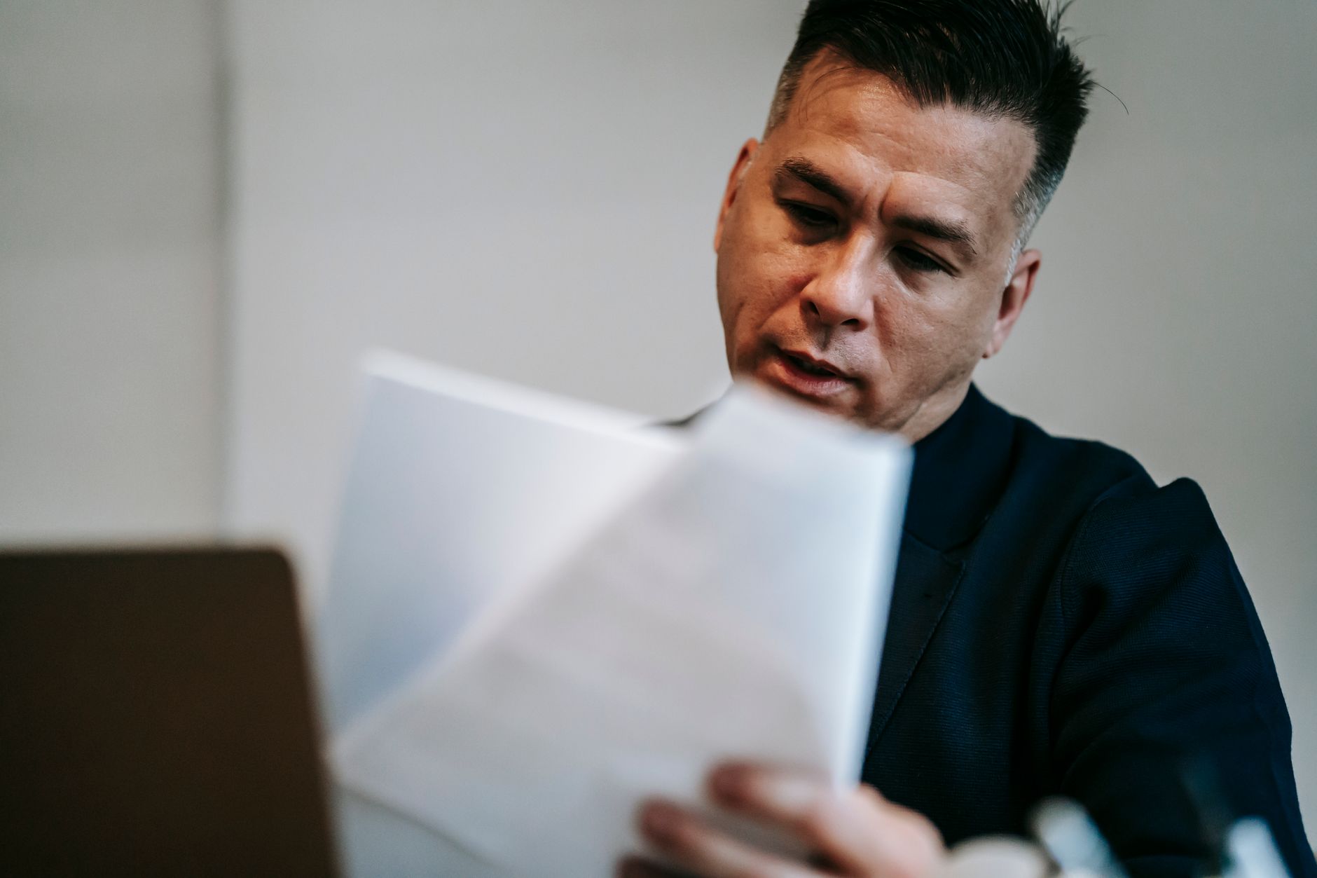 Defense contractor reviewing CMMC compliance cost documentation